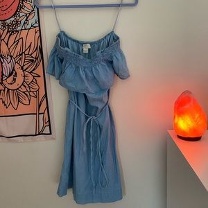 Blue off the shoulder dress.